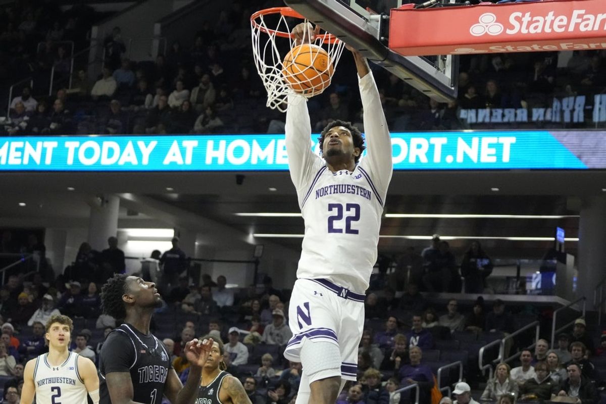 Dec 13, 2025; Evanston, Illinois, USA; Northwestern Wildcats forward Arrinten Page (22) dunks against the Jackson State Tigers during the first half at Welsh-Ryan Arena. Mandatory Credit: David Banks-Imagn Images