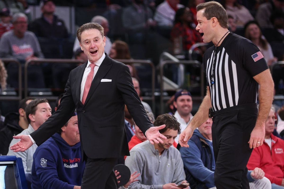 Dec 13, 2025; Queens, New York, USA;  St. John's Red Storm head coach Rick Pitino talks with an official in the second half against the Iona Gaels at Madison Square Garden. Mandatory Credit: Wendell Cruz-Imagn Images