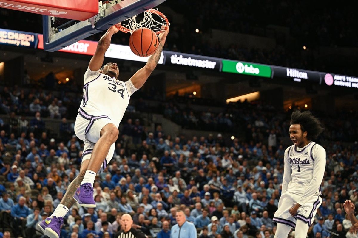 Dec 13, 2025; Omaha, Nebraska, USA; Kansas State Wildcats guard Nate Johnson (34) dunks against the Creighton Bluejays during the first half at CHI Health Center Omaha. Mandatory Credit: Steven Branscombe-Imagn Images