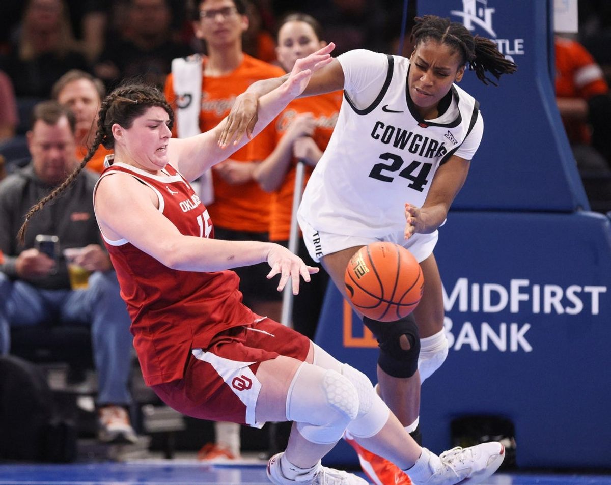 Oklahoma center Raegan Beers, left, and Oklahoma State forward Praise Egharevba (24) try to grab a rebound during the second half of a Bedlam women's college basketball game between the OSU Cowgirls and OU Sooners at Paycom Center in Oklahoma City, Saturday, Dec. 13, 2025.