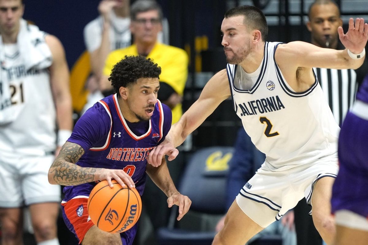 Dec 13, 2025; Berkeley, California, USA; Northwestern State Demons guard Izzy Miles (center left) dribbles against California Golden Bears forward John Camden (2) during the first half at Haas Pavilion. Mandatory Credit: Darren Yamashita-Imagn Images