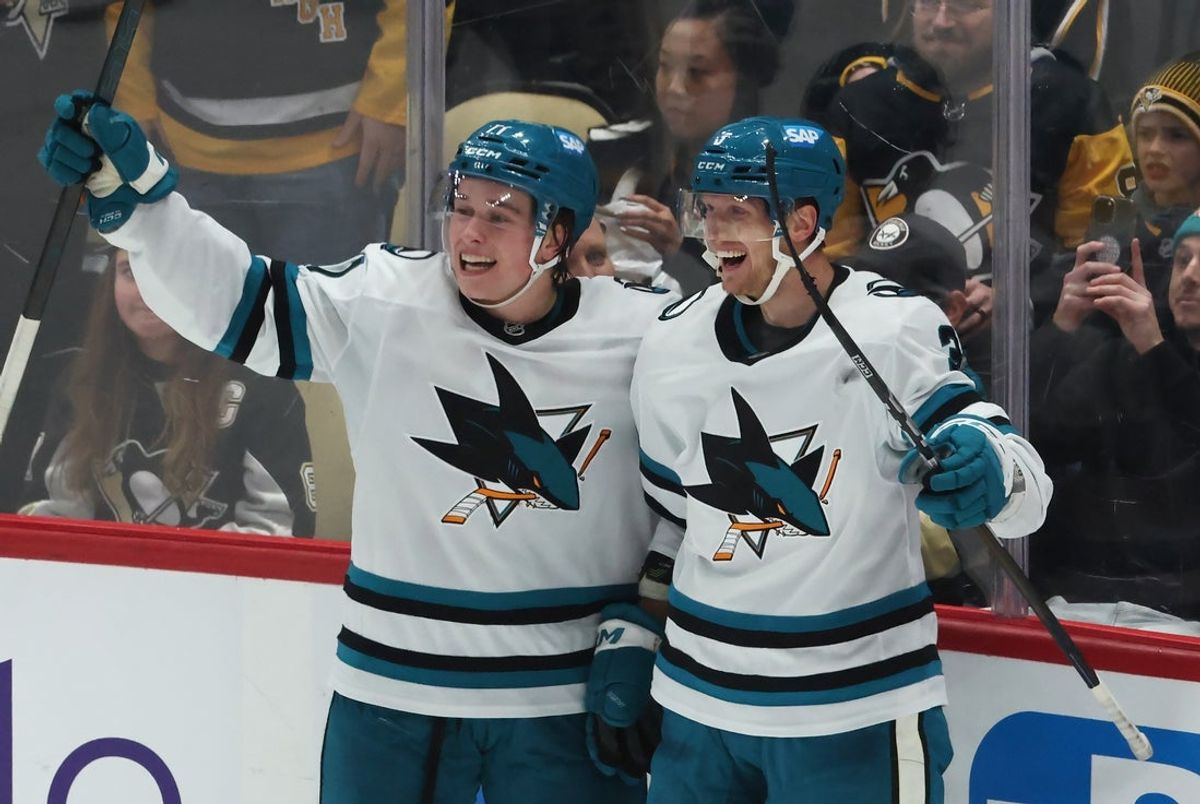 Dec 13, 2025; Pittsburgh, Pennsylvania, USA;  San Jose Sharks center Macklin Celebrini (left) and defenseman John Klingberg (right) celebrate an overtime game-winning goal by Klingberg to defeat the Pittsburgh Penguins at PPG Paints Arena. Mandatory Credit: Charles LeClaire-Imagn Images