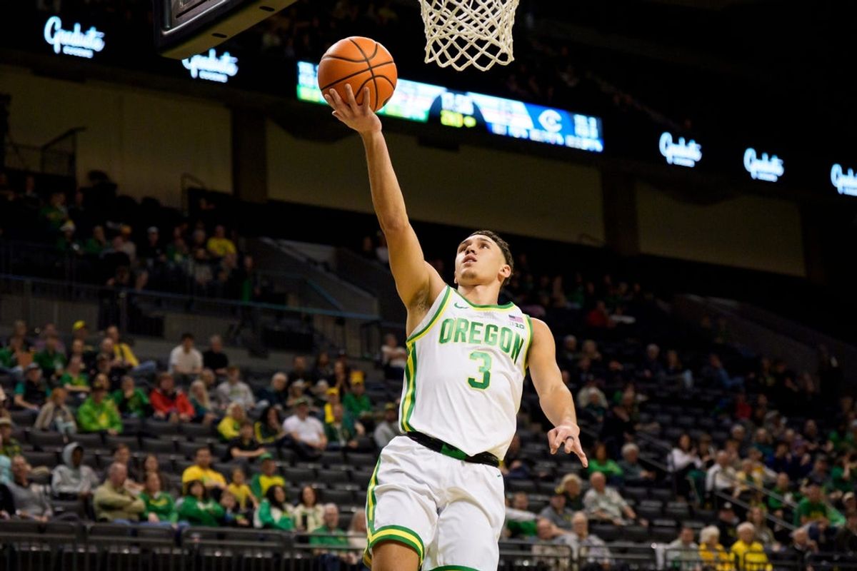Oregon guard Jackson Shelstad breaks away for a layup as the Oregon Ducks host the UC Davis Aggies on Dec. 13, 2025, at Matthew Knight Arena in Eugene, Oregon.