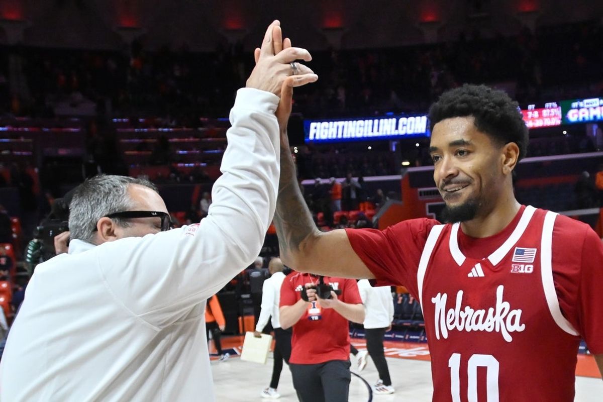 Dec 13, 2025; Champaign, Illinois, USA;  Nebraska Cornhuskers guard Jamarques Lawrence (10) gets a hand after Lawerence hit the game winning shot, 83-80 against the Illinois Fighting Illini during at State Farm Center. Mandatory Credit: Ron Johnson-Imagn Images