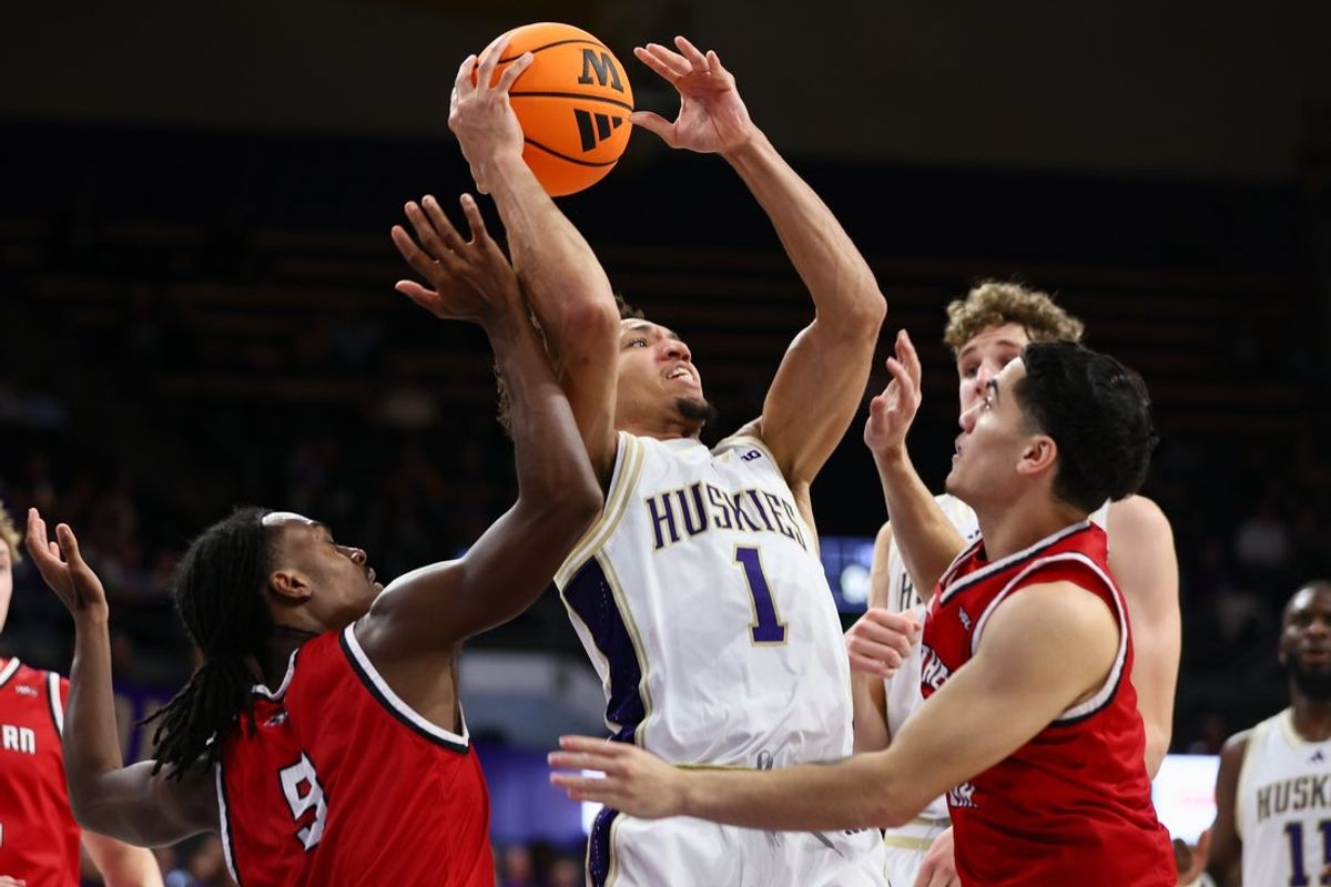 Dec 13, 2025; Seattle, Washington, USA; Washington Huskies guard Desmond Claude (1) is double teamed by Southern Utah Thunderbirds guard Jalen (Roc) Lee (9) and guard Lorenzo Abellar (4) in the first half at Alaska Airlines Arena at Hec Edmundson Pavilion. Mandatory Credit: Kevin Ng-Imagn Images