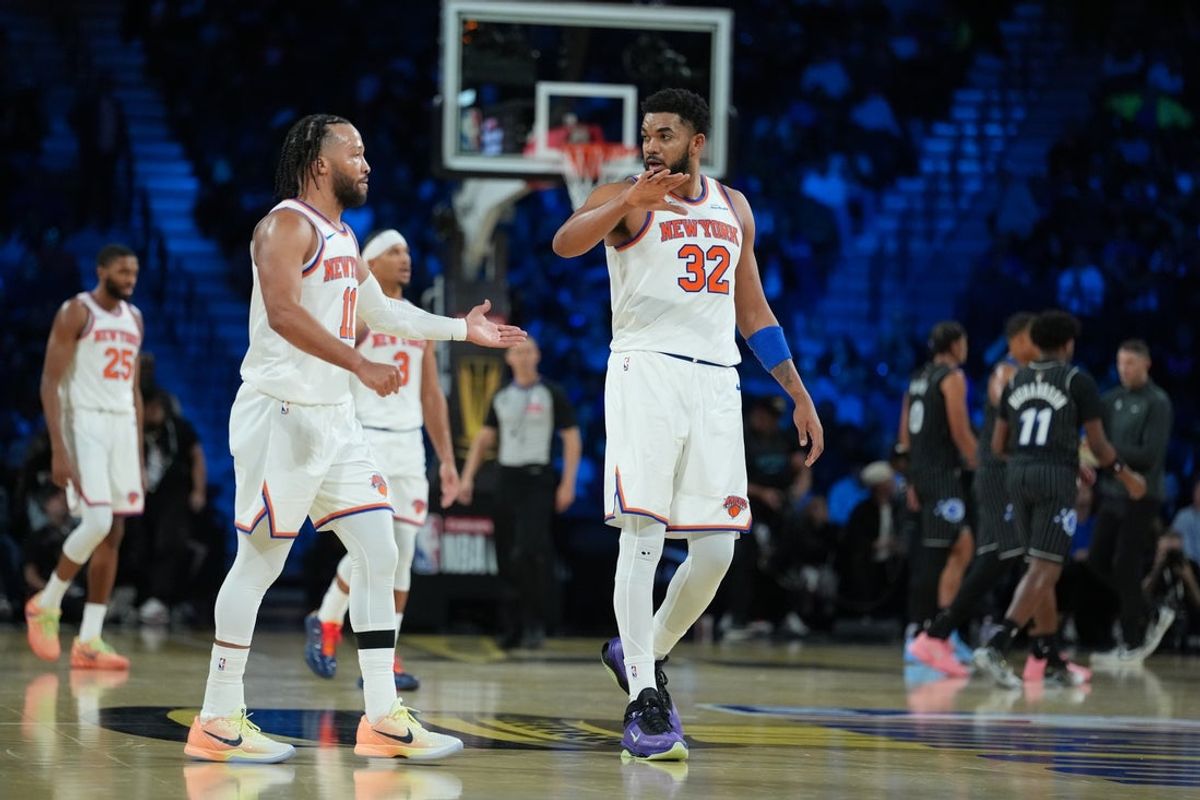 Dec 13, 2025; Las Vegas, Nevada, USA; New York Knicks guard Jalen Brunson (11) reacts with center Karl-Anthony Towns (32) against the Orlando Magic during the fourth quarter at T-Mobile Arena. Mandatory Credit: Kirby Lee-Imagn Images