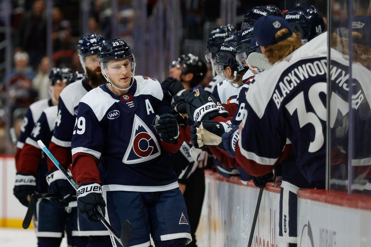 Dec 13, 2025; Denver, Colorado, USA; Colorado Avalanche center Nathan MacKinnon (29) celebrates with the bench after his goal in the first period against the Nashville Predators at Ball Arena. Mandatory Credit: Isaiah J. Downing-Imagn Images