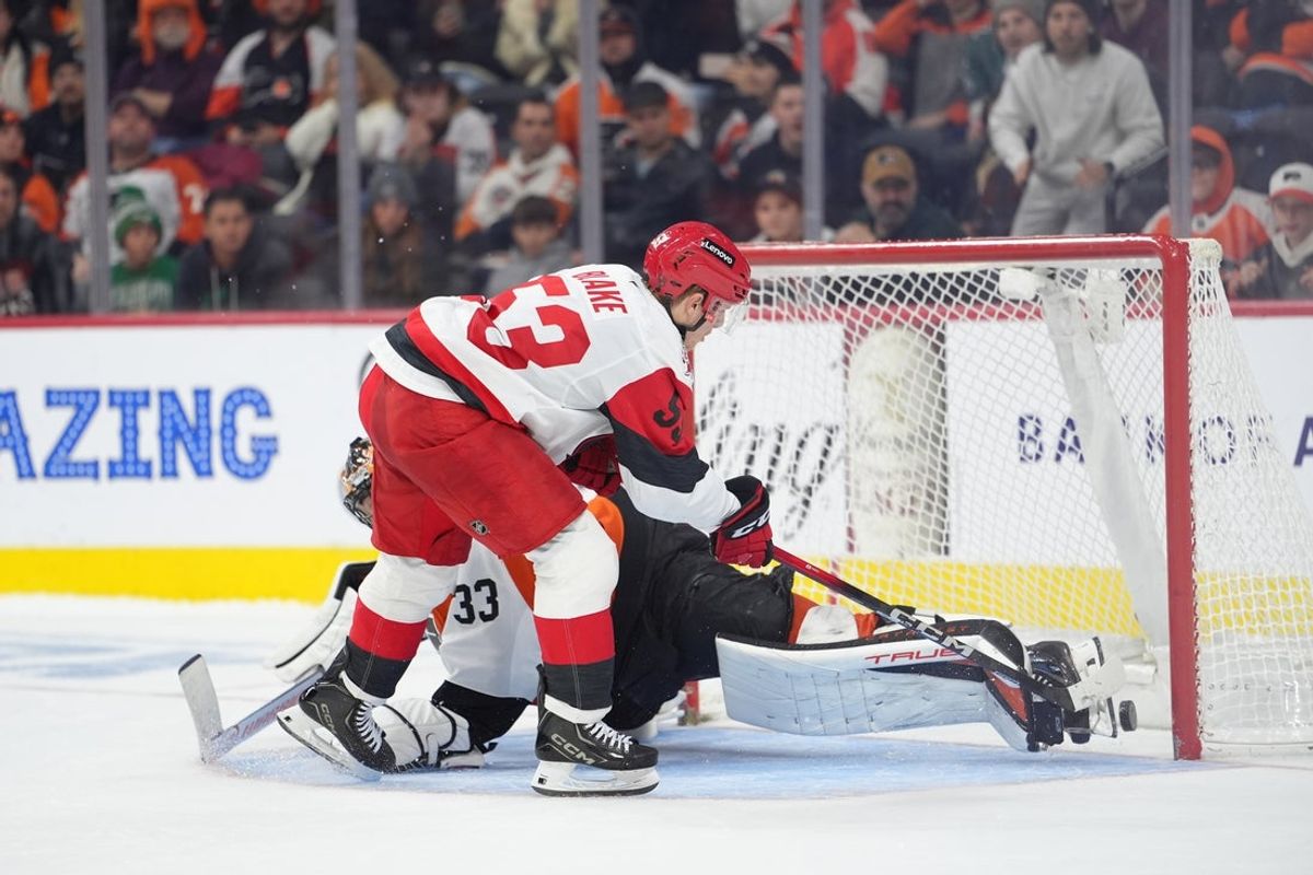Dec 13, 2025; Philadelphia, Pennsylvania, USA; Carolina Hurricanes right wing Jackson Blake (53) scores a shootout goal against Philadelphia Flyers goalie Samuel Ersson (33) in overtime at Xfinity Mobile Arena. Mandatory Credit: Kyle Ross-Imagn Images