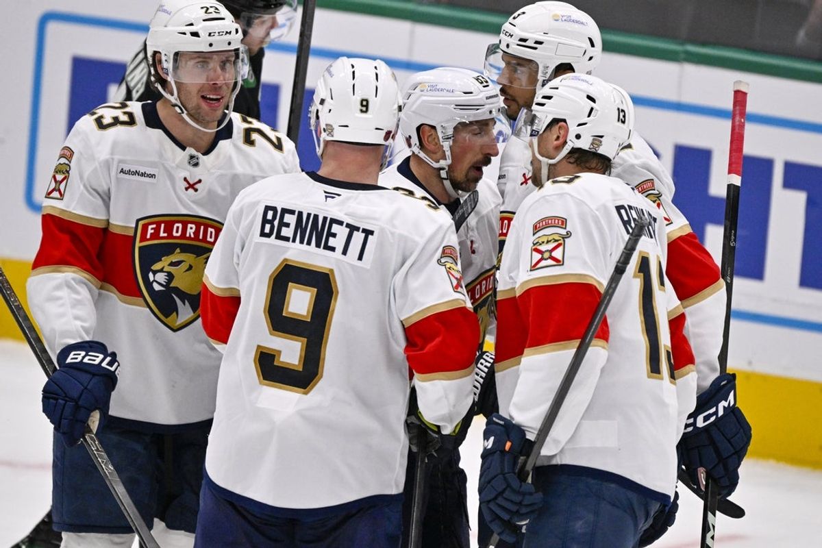 Dec 13, 2025; Dallas, Texas, USA; Florida Panthers center Carter Verhaeghe (23) and center Sam Bennett (9) and left wing Brad Marchand (63) and defenseman Seth Jones (3) and center Sam Reinhart (13) celebrates a power play goal scored by Marchand against the Dallas Stars during the second period at the American Airlines Center. Mandatory Credit: Jerome Miron-Imagn Images