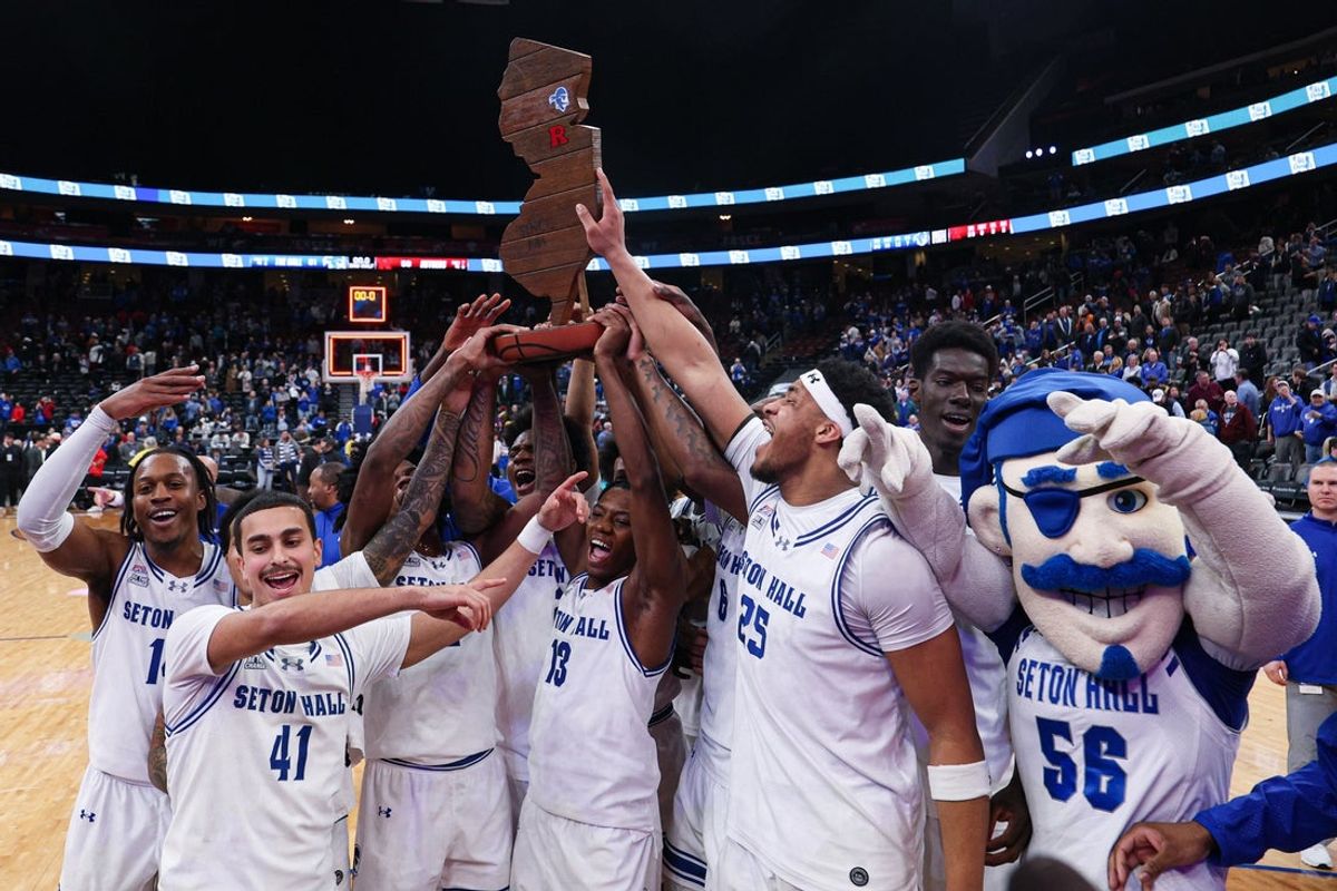 Dec 13, 2025; Newark, New Jersey, USA; Seton Hall Pirates celebrate with the Garden State Hardwood Classic trophy after their game against the Rutgers Scarlet Knights at Prudential Center. Mandatory Credit: Vincent Carchietta-Imagn Images