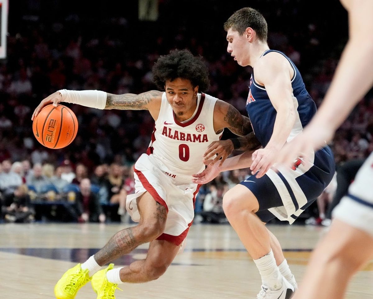 Dec 13, 2025; Birmingham, AL, USA; Alabama guard Labaron Philon Jr. (0) drives into the lane against Arizona forward Ivan Kharchenkov (8) at Legacy Arena. Mandatory Credit: Gary Cosby Jr.-Tuscaloosa News
