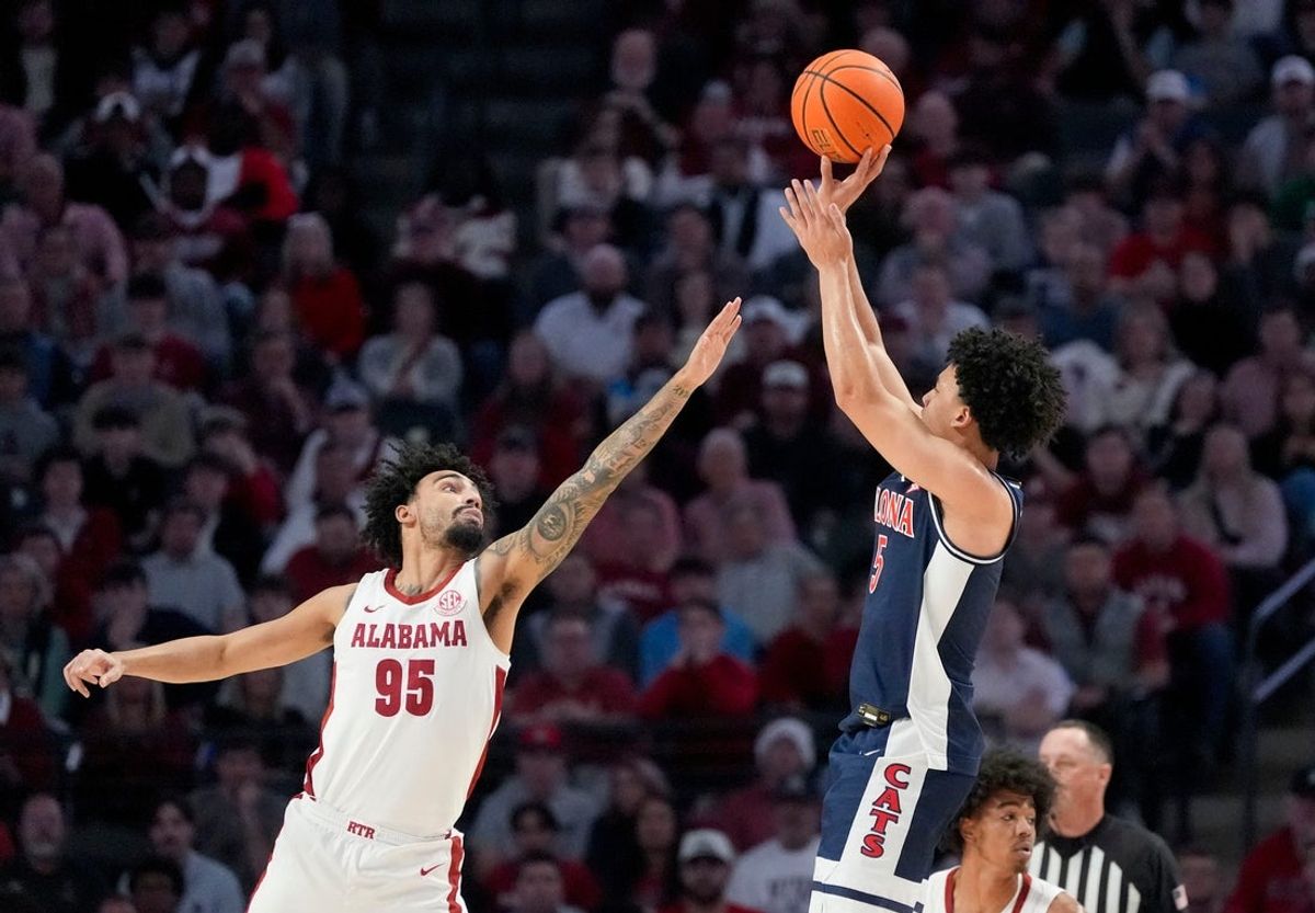 Dec 13, 2025; Birmingham, AL, USA; Arizona guard Brayden Burries (5) shoots a three over Alabama guard Houston Mallette (95) at Legacy Arena. Mandatory Credit: Gary Cosby Jr.-Tuscaloosa News