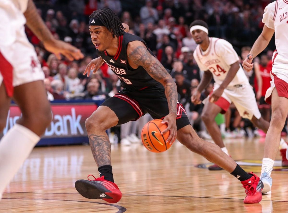 Texas Tech's JT Toppin drives the lane against Arkansas during a non-conference men's basketball game, Saturday, Dec. 13, 2025, in American Airlines Center in Dallas.
