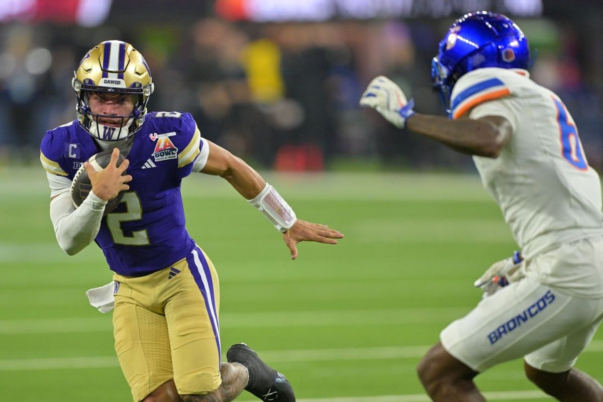 Dec 13, 2025; Inglewood, CA, USA;  Washington Huskies quarterback Demond Williams Jr. (2) is forced out of bounds by Boise State Broncos defensive back Jeremiah Earby (6) after a catching a pass in the second half of the LA Bowl at SoFi Stadium. Mandatory Credit: Jayne Kamin-Oncea-Imagn Images