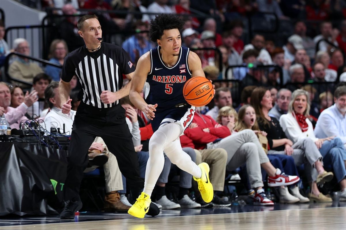 Dec 13, 2025; Birmingham, Alabama, USA; Arizona Wildcats guard Brayden Burries (5) makes a fast break during the second half against the Alabama Crimson Tide at Legacy Arena at BJCC. Mandatory Credit: David Leong-Imagn Images