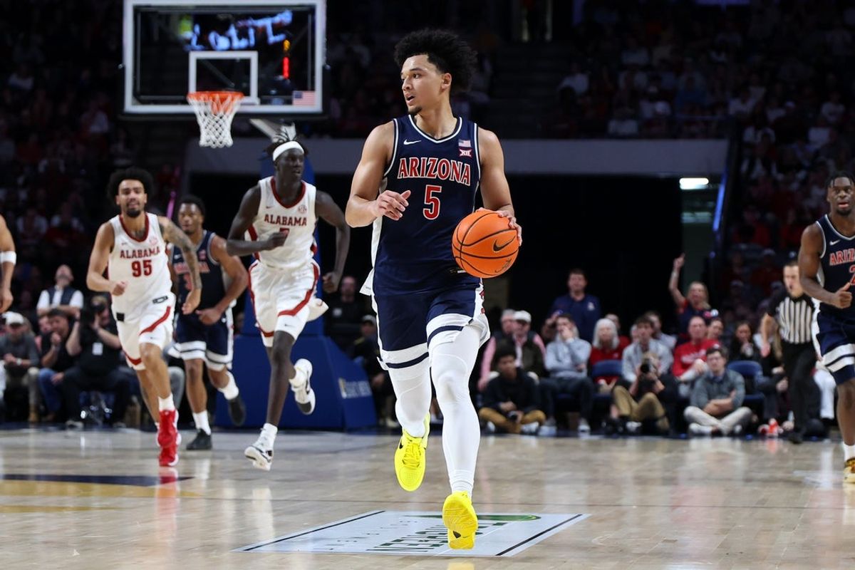 Dec 13, 2025; Birmingham, Alabama, USA; Arizona Wildcats guard Brayden Burries (5) dribbles down court during the second half against the Alabama Crimson Tide at Legacy Arena at BJCC. Mandatory Credit: David Leong-Imagn Images