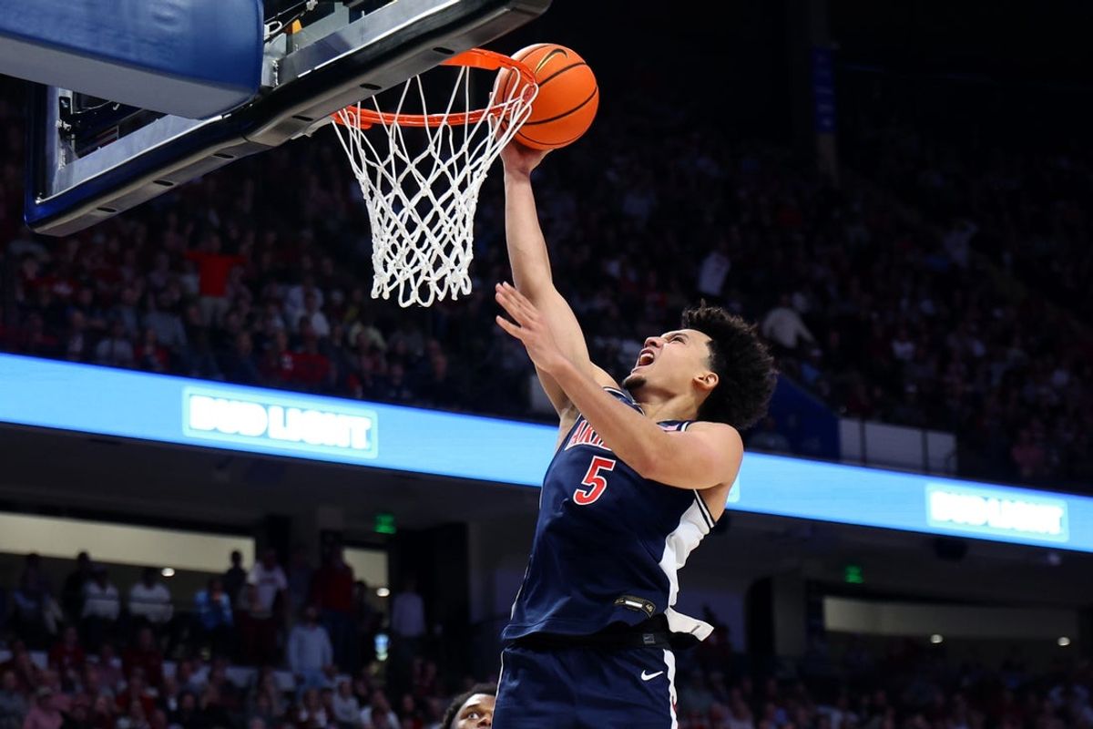 Dec 13, 2025; Birmingham, Alabama, USA; Arizona Wildcats guard Brayden Burries (5) makes a layup during the second half against the Alabama Crimson Tide at Legacy Arena at BJCC. Mandatory Credit: David Leong-Imagn Images