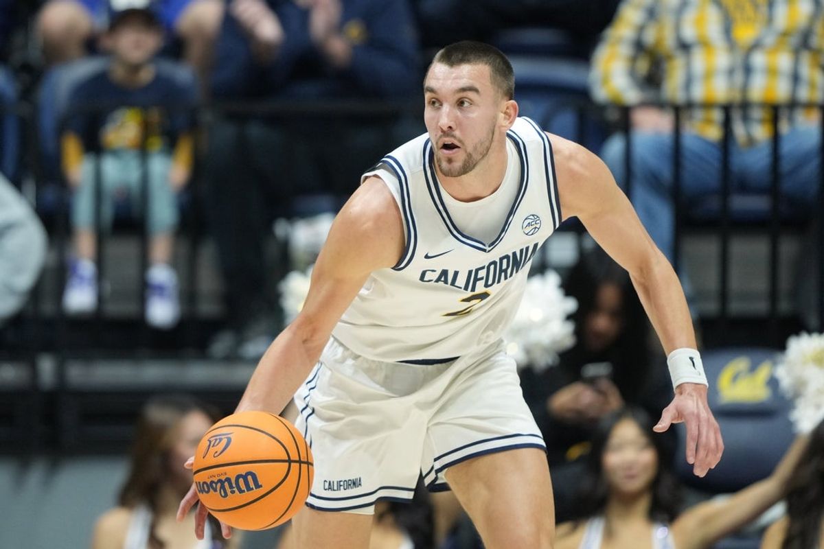 Dec 13, 2025; Berkeley, California, USA; California Golden Bears forward John Camden (2) dribbles against the Northwestern State Demons during the first half at Haas Pavilion. Mandatory Credit: Darren Yamashita-Imagn Images