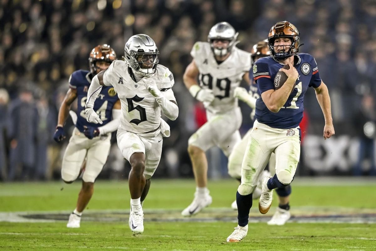 Dec 13, 2025; Baltimore, Maryland, USA;   Navy Midshipmen quarterback Blake Horvath (11) rushes during the game against the Army West Point Black Knights at M&T Bank Stadium. Mandatory Credit: Tommy Gilligan-Imagn Images