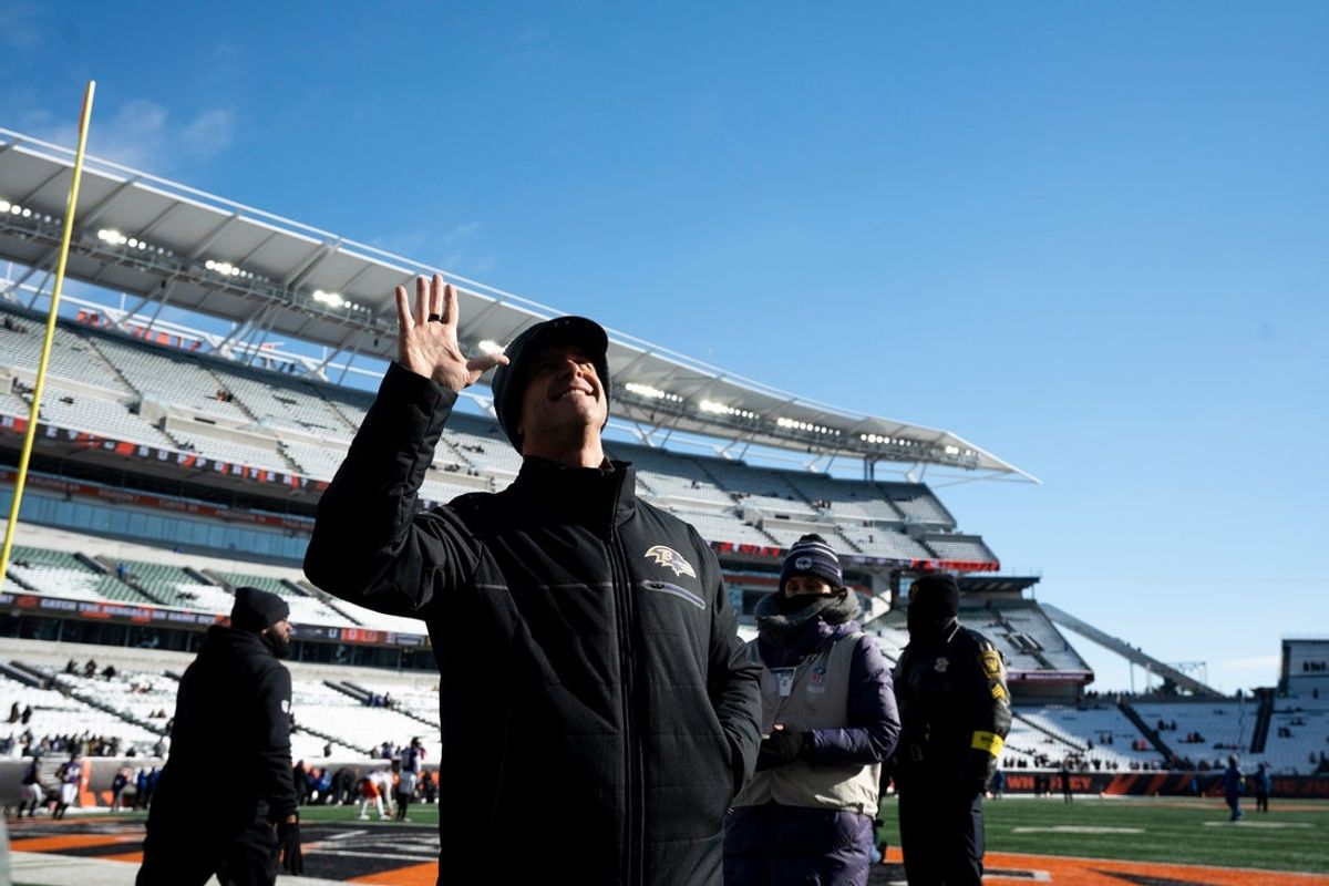 Baltimore Ravens head coach John Harbaugh waives to Baltimore Ravens fans before the NFL football game between Baltimore Ravens and Cincinnati Bengals at Paycor Stadium in Cincinnati on Dec. 14, 2025.