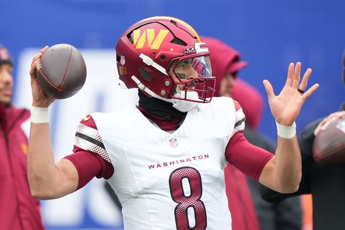 Dec 14, 2025; East Rutherford, New Jersey, USA;  Washington Commanders quarterback Marcus Mariota (8) warms up prior to the game against the New York Giants at MetLife Stadium. Mandatory Credit: Robert Deutsch-Imagn Images
