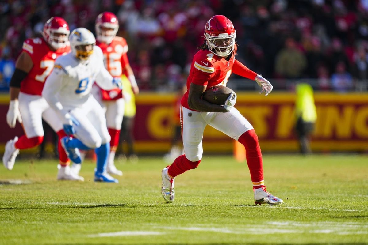 Dec 14, 2025; Kansas City, Missouri, USA; Kansas City Chiefs wide receiver Rashee Rice (4) runs for yards after the catch against the Los Angeles Chargers during the first quarter at GEHA Field at Arrowhead Stadium. Mandatory Credit: Jay Biggerstaff-Imagn Images