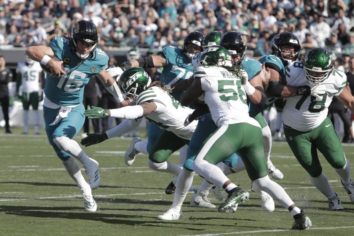 Dec 14, 2025; Jacksonville, Florida, USA; Jacksonville Jaguars quarterback Trevor Lawrence (16) runs with the ball during the first quarter against the New York Jets at EverBank Stadium. Mandatory Credit: Travis Register-Imagn Images