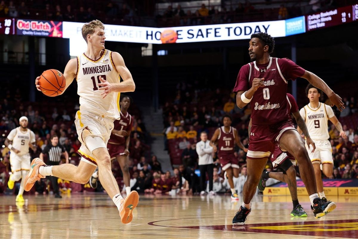 Dec 14, 2025; Minneapolis, Minnesota, USA; Minnesota Golden Gophers forward Cade Tyson (10) drives towards the basket as Texas Southern Tigers guard Alex Anderson (0) defends during the first half at Williams Arena. Mandatory Credit: Matt Krohn-Imagn Images