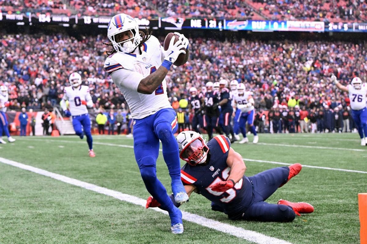 Dec 14, 2025; Foxborough, Massachusetts, USA; Buffalo Bills running back James Cook III (4) scores a touchdown against the New England Patriots during the first half at Gillette Stadium. Mandatory Credit: Brian Fluharty-Imagn Images