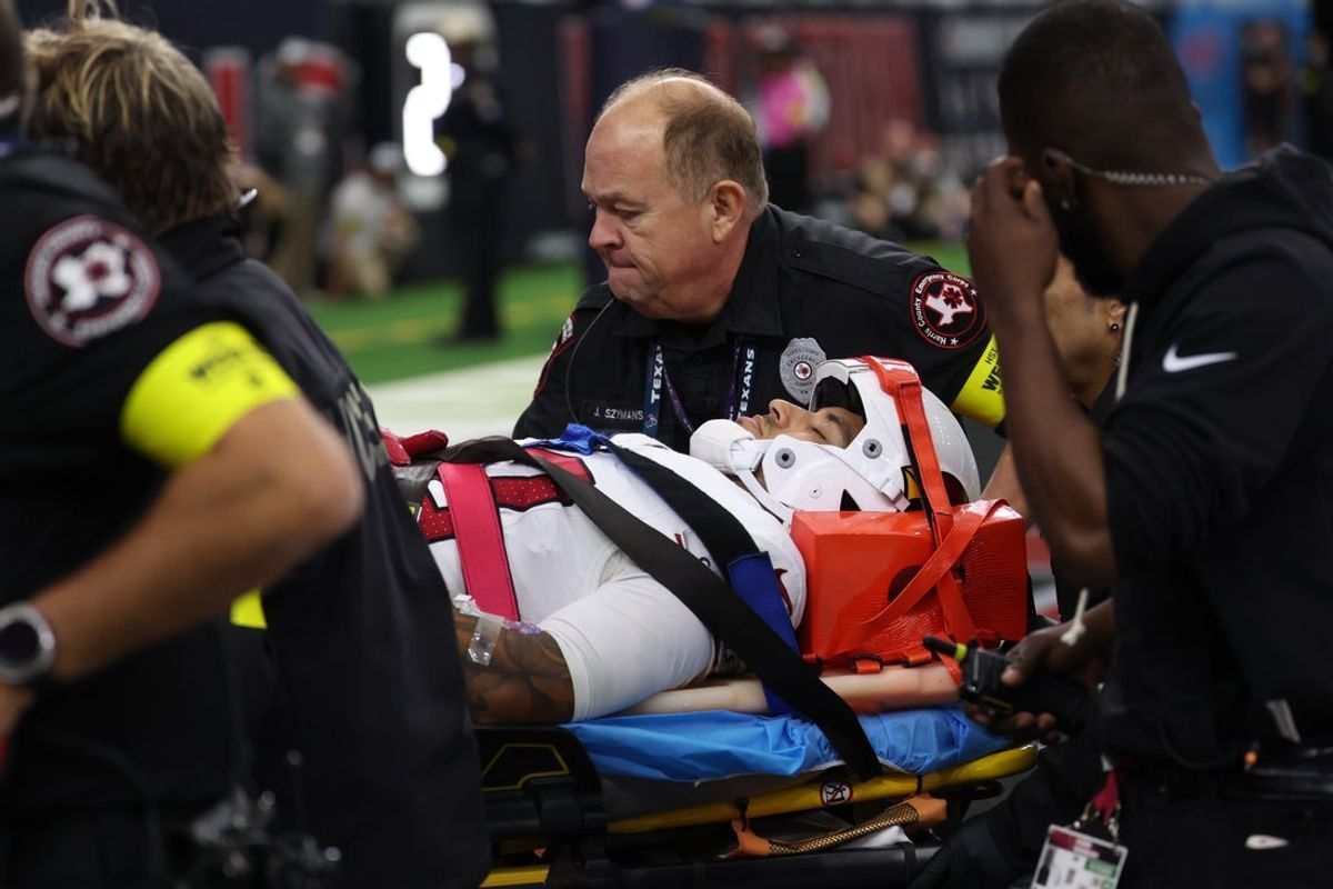 Dec 14, 2025; Houston, Texas, USA; Medical personnel treat Arizona Cardinals wide receiver Andre Baccellia (82) following an injury on a kickoff return during the second quarter against the Houston Texans at NRG Stadium. Mandatory Credit: Thomas Shea-Imagn Images