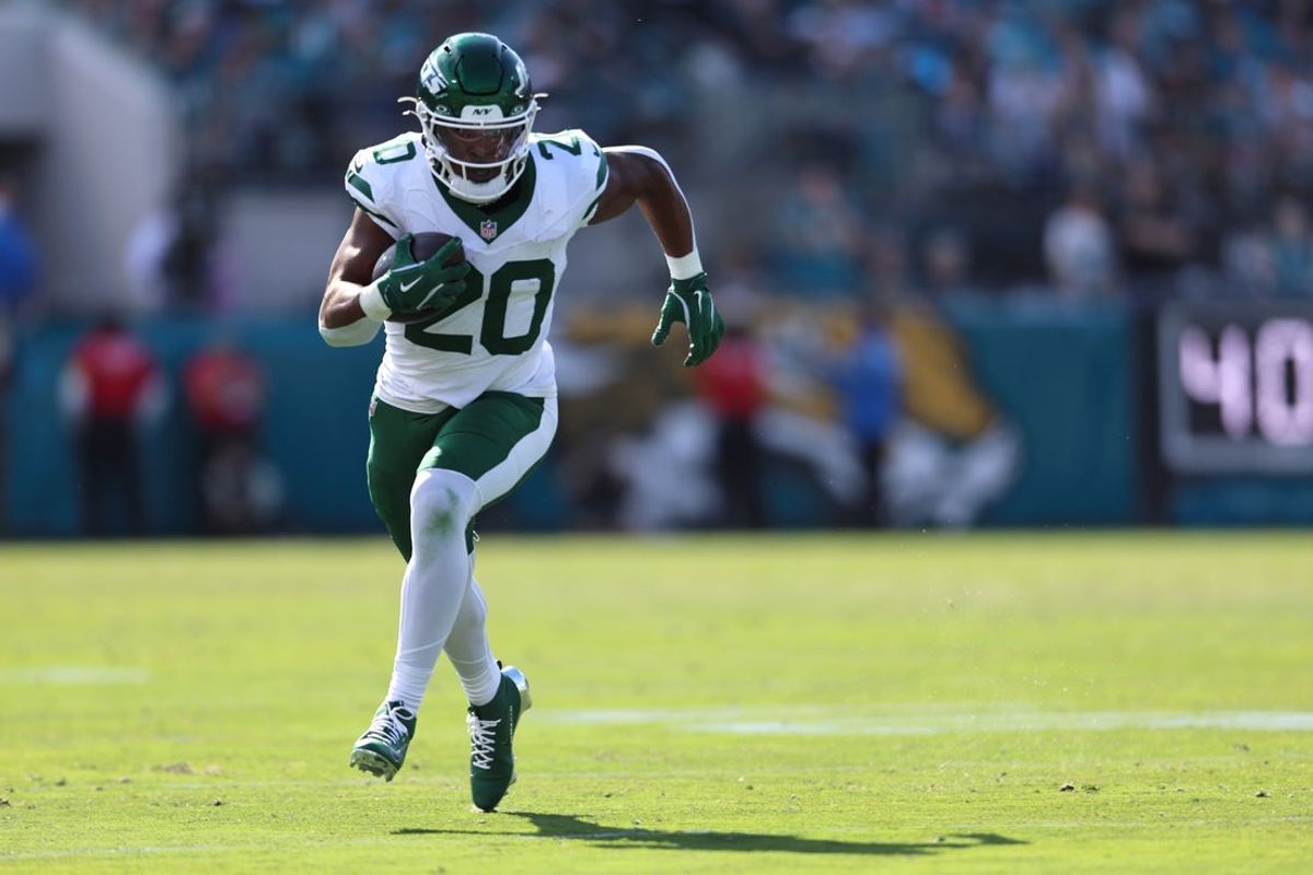 Dec 14, 2025; Jacksonville, Florida, USA; New York Jets running back Breece Hall (20) runs with the ball during the first quarter against the Jacksonville Jaguars at EverBank Stadium. Mandatory Credit: Morgan Tencza-Imagn Images