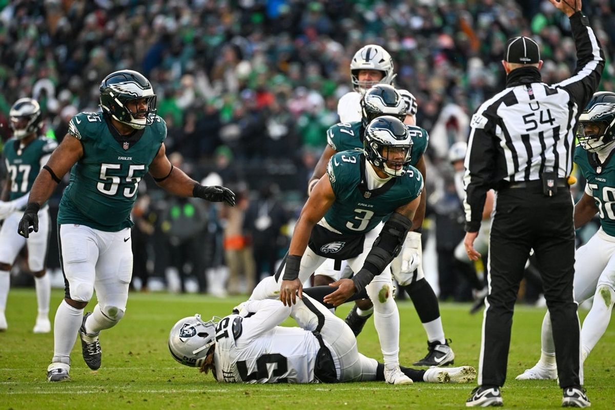 Dec 14, 2025; Philadelphia, Pennsylvania, USA; Las Vegas Raiders quarterback Kenny Pickett (15) is sacked by Philadelphia Eagles linebacker Nolan Smith Jr. (3) during the third quarter at Lincoln Financial Field. Mandatory Credit: Eric Hartline-Imagn Images