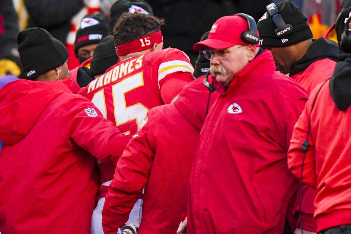 Dec 14, 2025; Kansas City, Missouri, USA; Kansas City Chiefs quarterback Patrick Mahomes (15) is attended to by team medical staff following an injury during the fourth quarter against the Los Angeles Chargers at GEHA Field at Arrowhead Stadium. Kansas City Chiefs head coach Andy Reid, second from right, stands on the sideline Mandatory Credit: Jay Biggerstaff-Imagn Images