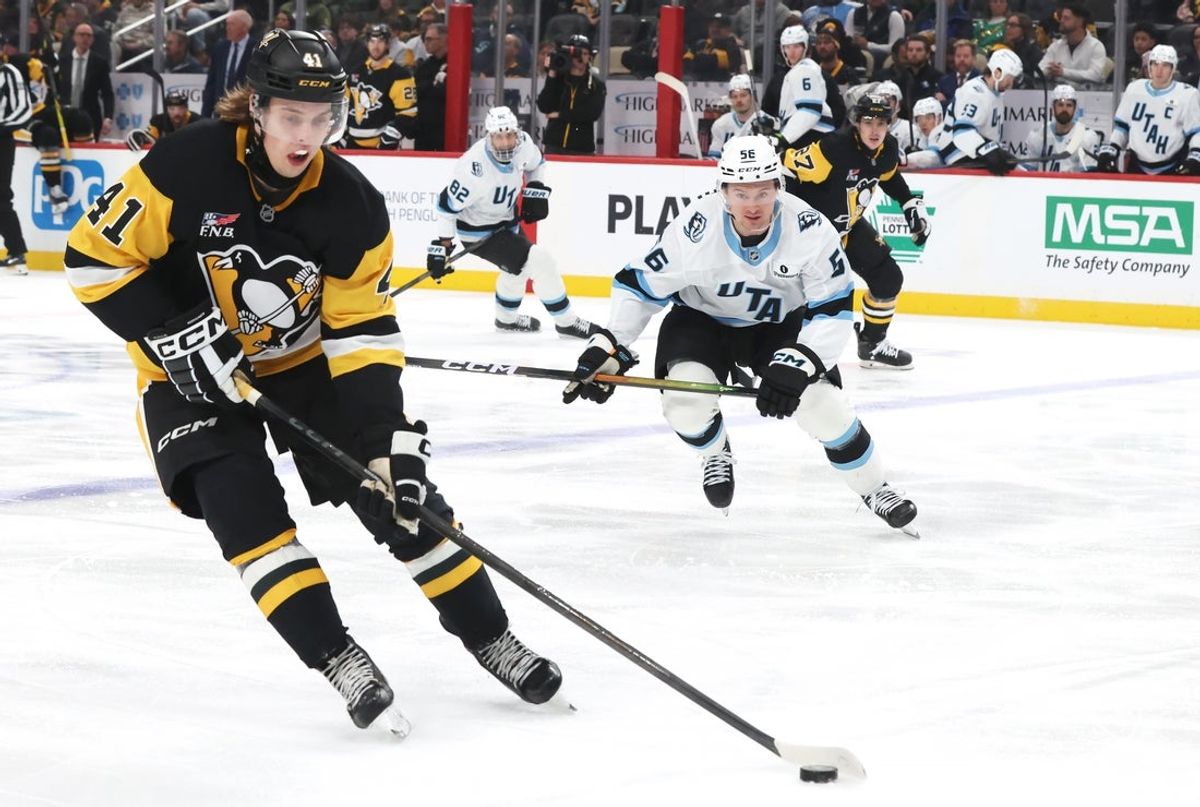 Dec 14, 2025; Pittsburgh, Pennsylvania, USA;  Pittsburgh Penguins right wing Ville Koivunen (41) moves the puck against the Utah Mammoth during the second period at PPG Paints Arena. Mandatory Credit: Charles LeClaire-Imagn Images