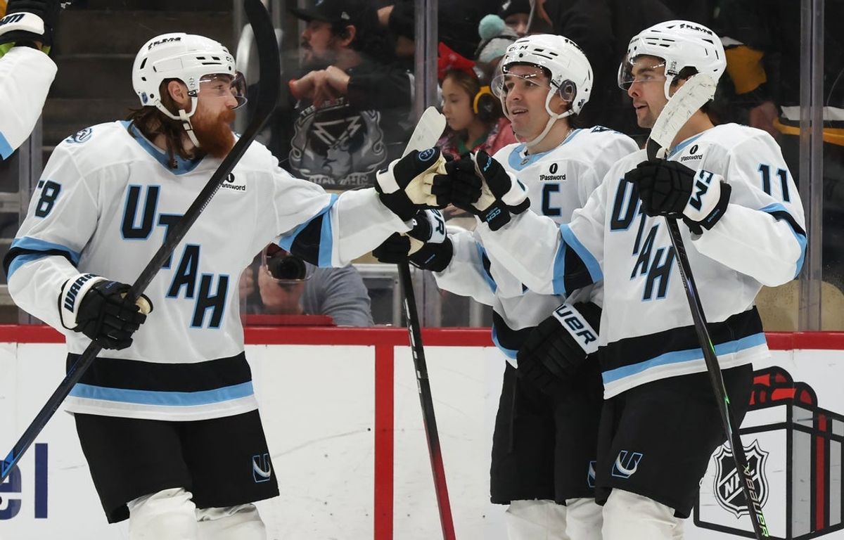 Dec 14, 2025; Pittsburgh, Pennsylvania, USA;  Utah Mammoth center Liam O'Brien (38) congratulates right wing Dylan Guenther (11) on his game winning goal in overtime to defeat the Pittsburgh Penguins at PPG Paints Arena. Mandatory Credit: Charles LeClaire-Imagn Images