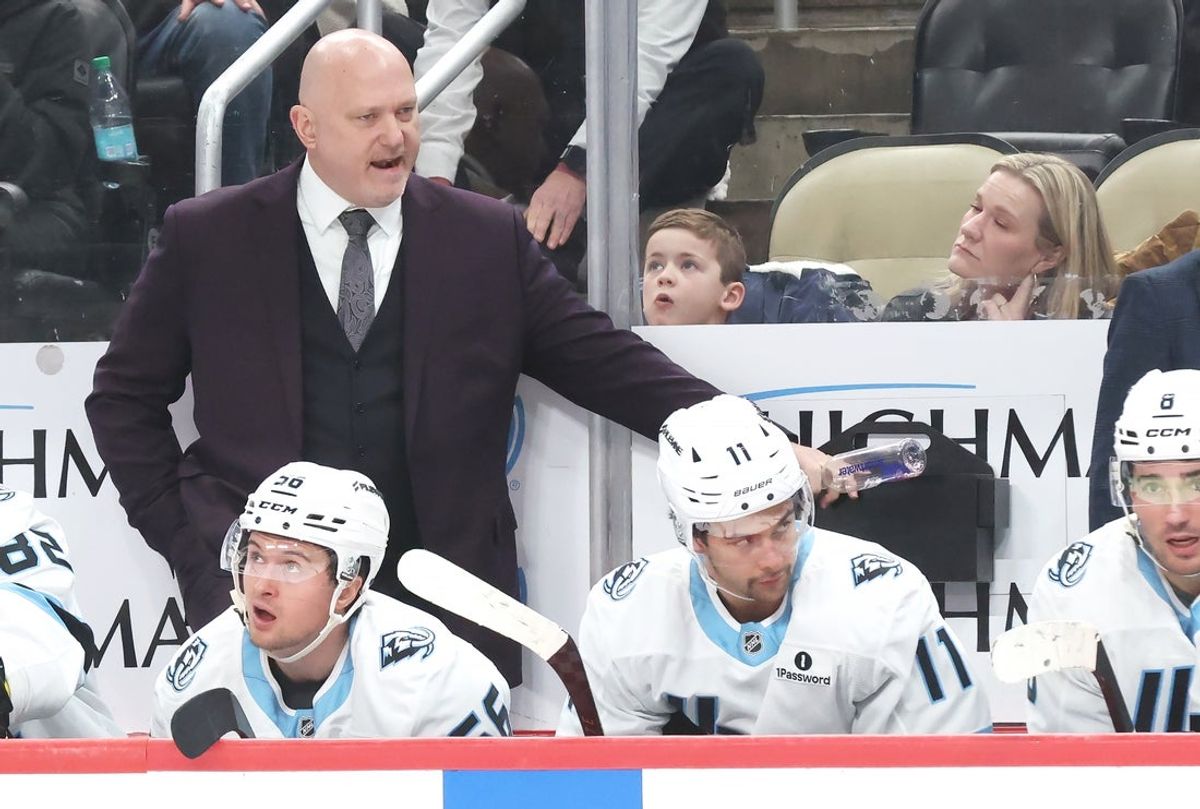 Dec 14, 2025; Pittsburgh, Pennsylvania, USA;  Utah Mammoth head coach Andre’ Tourigny (top) reacts on the bench against the Pittsburgh Penguins during the second period at PPG Paints Arena. Mandatory Credit: Charles LeClaire-Imagn Images