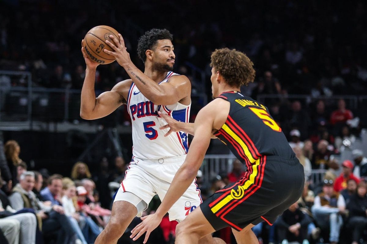 Dec 14, 2025; Atlanta, Georgia, USA; Philadelphia 76ers guard Quentin Grimes (5) looks to pass against Atlanta Hawks guard Dyson Daniels (5) during the first quarter at State Farm Arena. Mandatory Credit: Jordan Godfree-Imagn Images