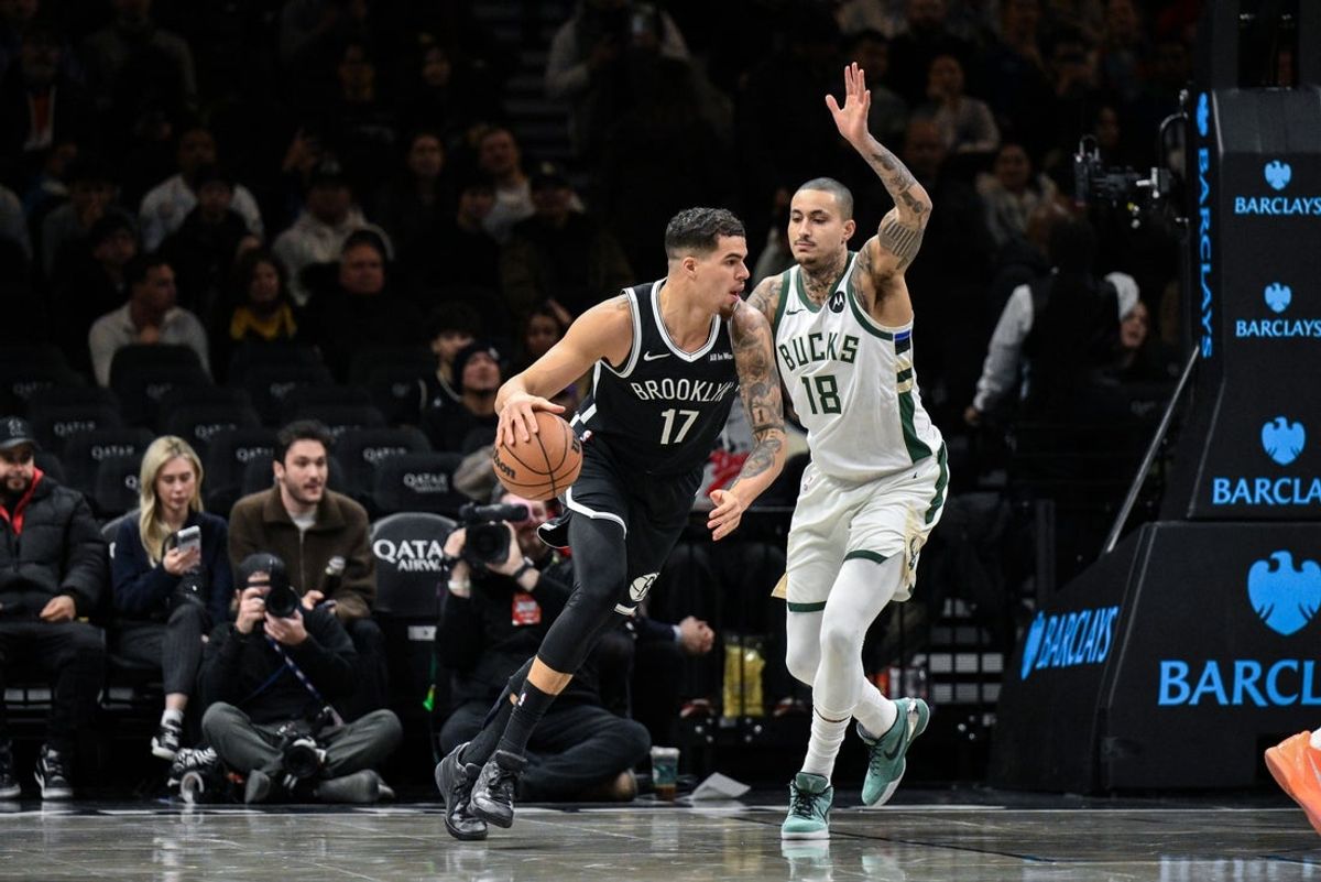 Dec 14, 2025; Brooklyn, New York, USA; Brooklyn Nets forward Michael Porter Jr. (17) looks to shoot the ball as Milwaukee Bucks forward Kyle Kuzma (18) defends during the first half at Barclays Center. Mandatory Credit: John Jones-Imagn Images
