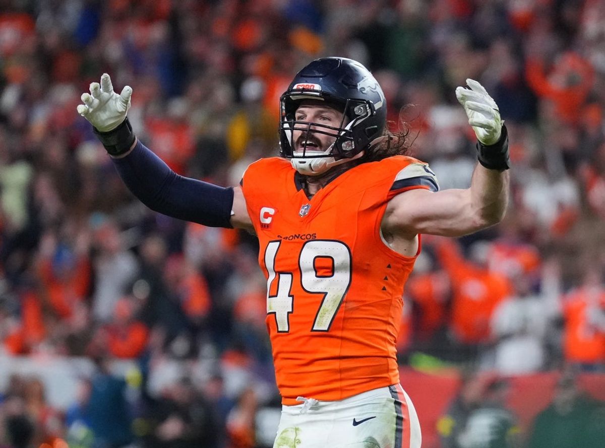 Dec 14, 2025; Denver, Colorado, USA; Denver Broncos linebacker Alex Singleton (49) celebrates defeating the Green Bay Packers during the fourth quarter at Empower Field at Mile High. Mandatory Credit: Ron Chenoy-Imagn Images