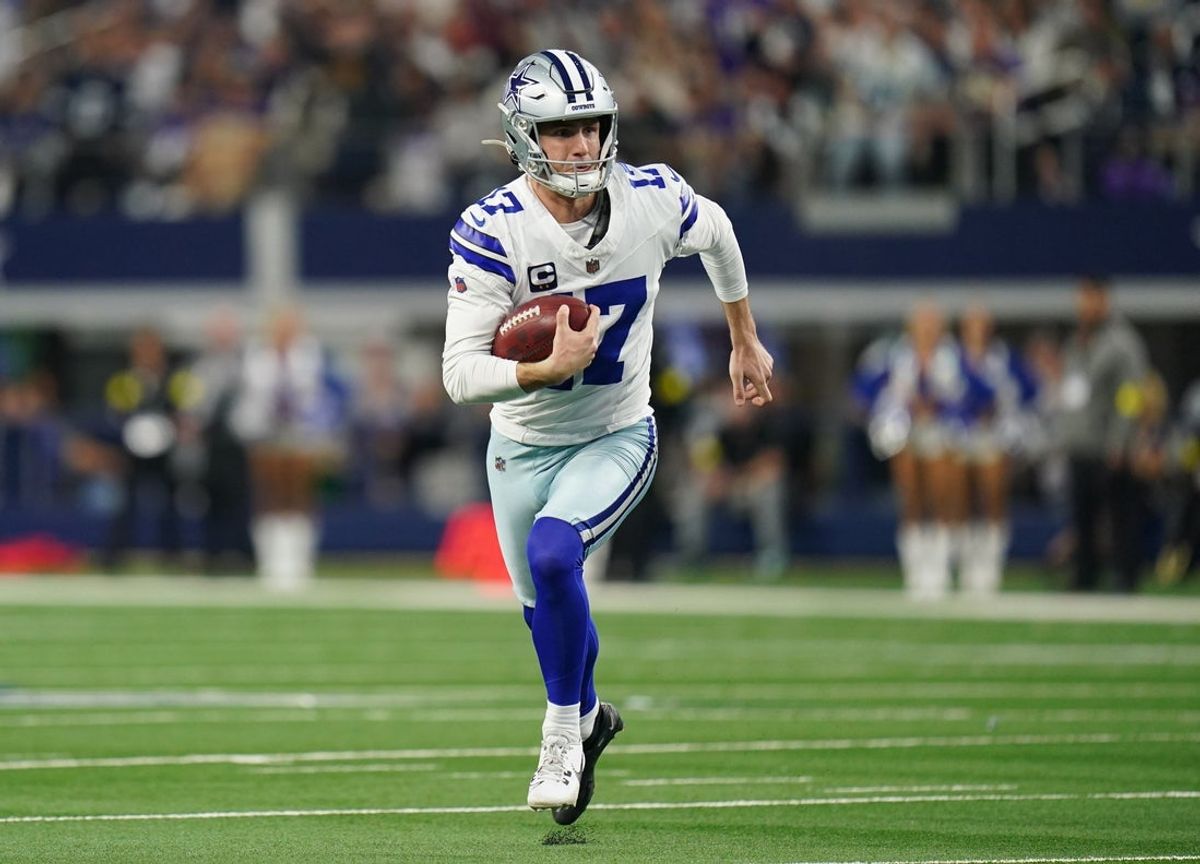 Dec 14, 2025; Arlington, Texas, USA; Dallas Cowboys place kicker Brandon Aubrey (17) runs a fake field goal during the first half against the Minnesota Vikings at AT&T Stadium. Mandatory Credit: Raymond Carlin III-Imagn Images
