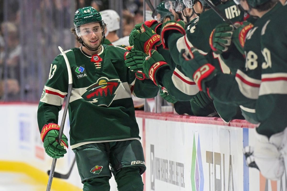 Dec 14, 2025; Saint Paul, Minnesota, USA;  Minnesota Wild defensemen Quinn Hughes (43) celebrates after scoring a goal against the Boston Bruins during the third period at Grand Casino Arena. Mandatory Credit: Nick Wosika-Imagn Images