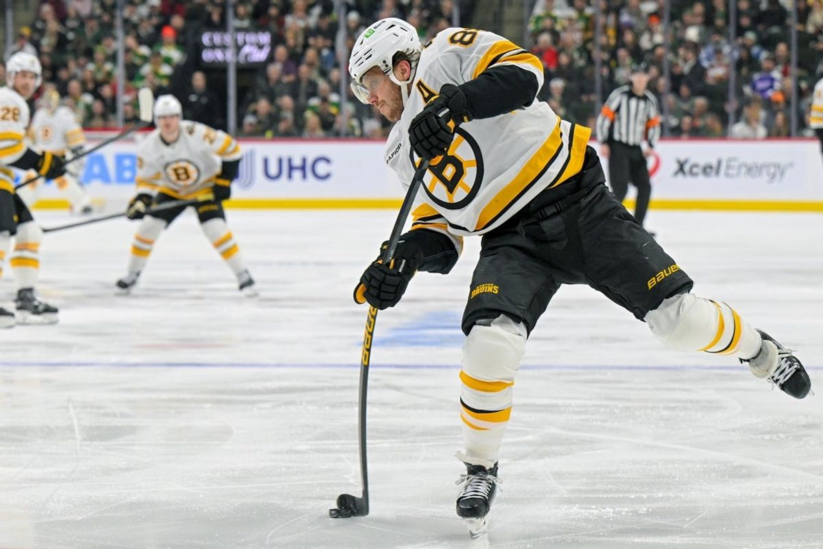 Dec 14, 2025; Saint Paul, Minnesota, USA;  Boston Bruins forward David Pastrnak (88) shoots the puck against the Minnesota Wild during the third period at Grand Casino Arena. Mandatory Credit: Nick Wosika-Imagn Images