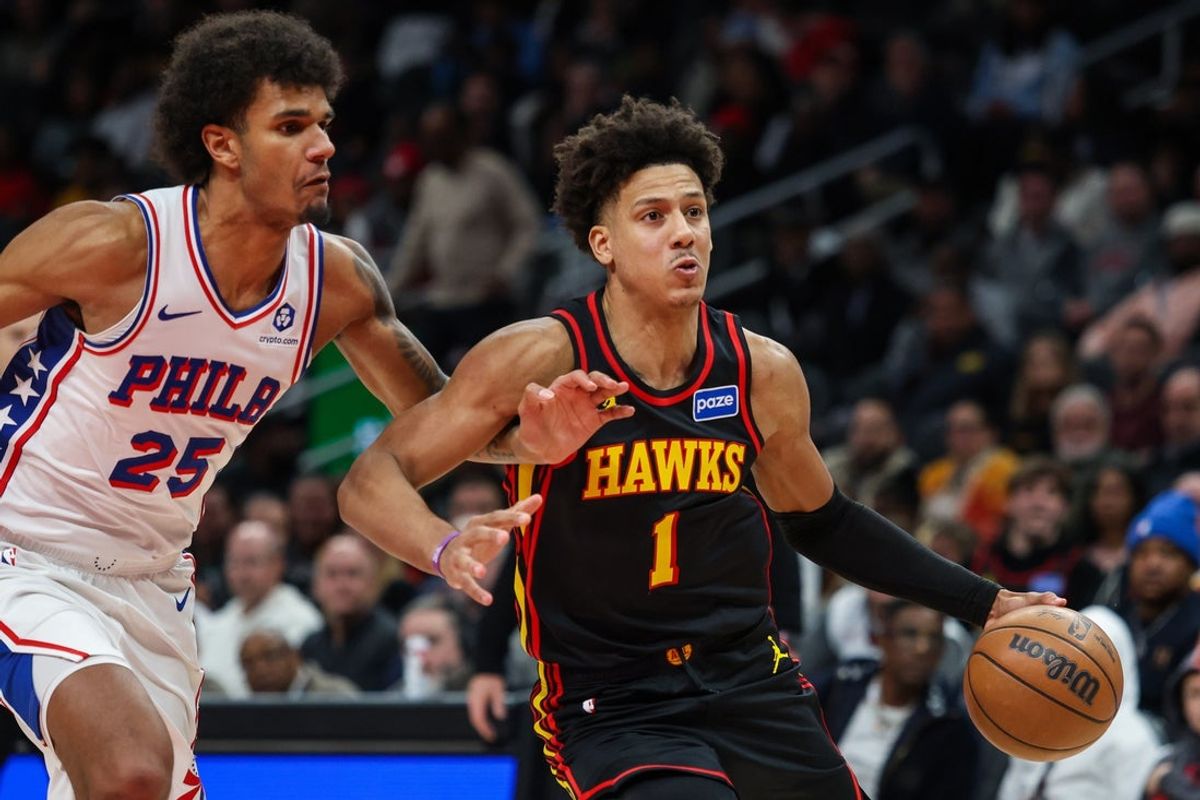 Dec 14, 2025; Atlanta, Georgia, USA; Atlanta Hawks forward Jalen Johnson (1) drives the ball towards the basket against Philadelphia 76ers forward Dominick Barlow (25) during the fourth quarter at State Farm Arena. Mandatory Credit: Jordan Godfree-Imagn Images