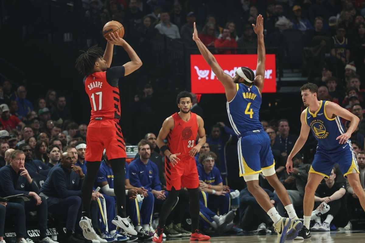 Dec 14, 2025; Portland, Oregon, USA; Portland Trail Blazers guard Shaedon Sharpe (17) shoots the ball over Golden State Warriors guard Moses Moody (4) during the first half at Moda Center. Mandatory Credit: Jaime Valdez-Imagn Images