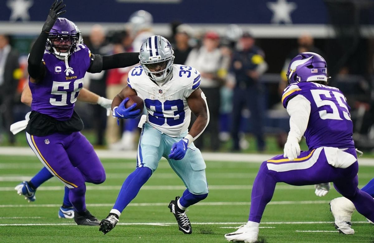 Dec 14, 2025; Arlington, Texas, USA; Dallas Cowboys running back Javonte Williams (33) runs against Minnesota Vikings linebacker Jonathan Greenard (58) and linebacker Eric Wilson (55) during the second half at AT&T Stadium. Mandatory Credit: Raymond Carlin III-Imagn Images