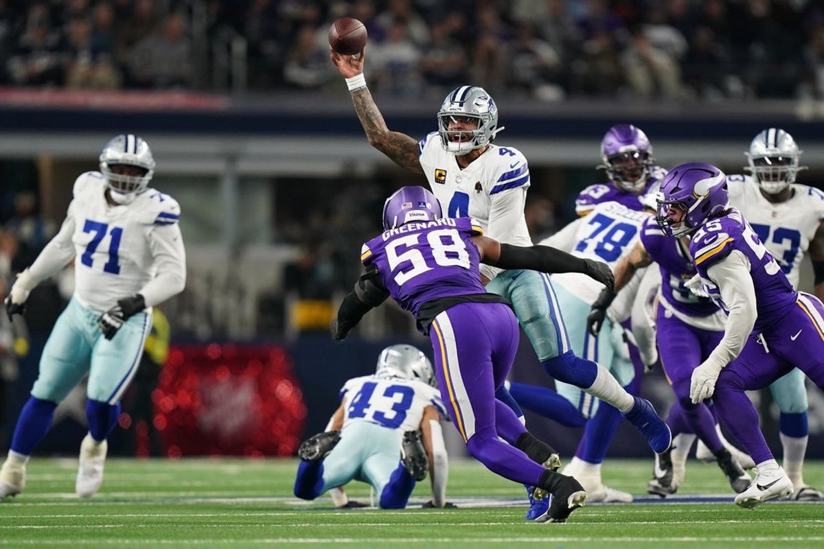 Dec 14, 2025; Arlington, Texas, USA; Dallas Cowboys quarterback Dak Prescott (4) throws against Minnesota Vikings linebacker Jonathan Greenard (58) and linebacker Eric Wilson (55) during the second half at AT&T Stadium. Mandatory Credit: Raymond Carlin III-Imagn Images
