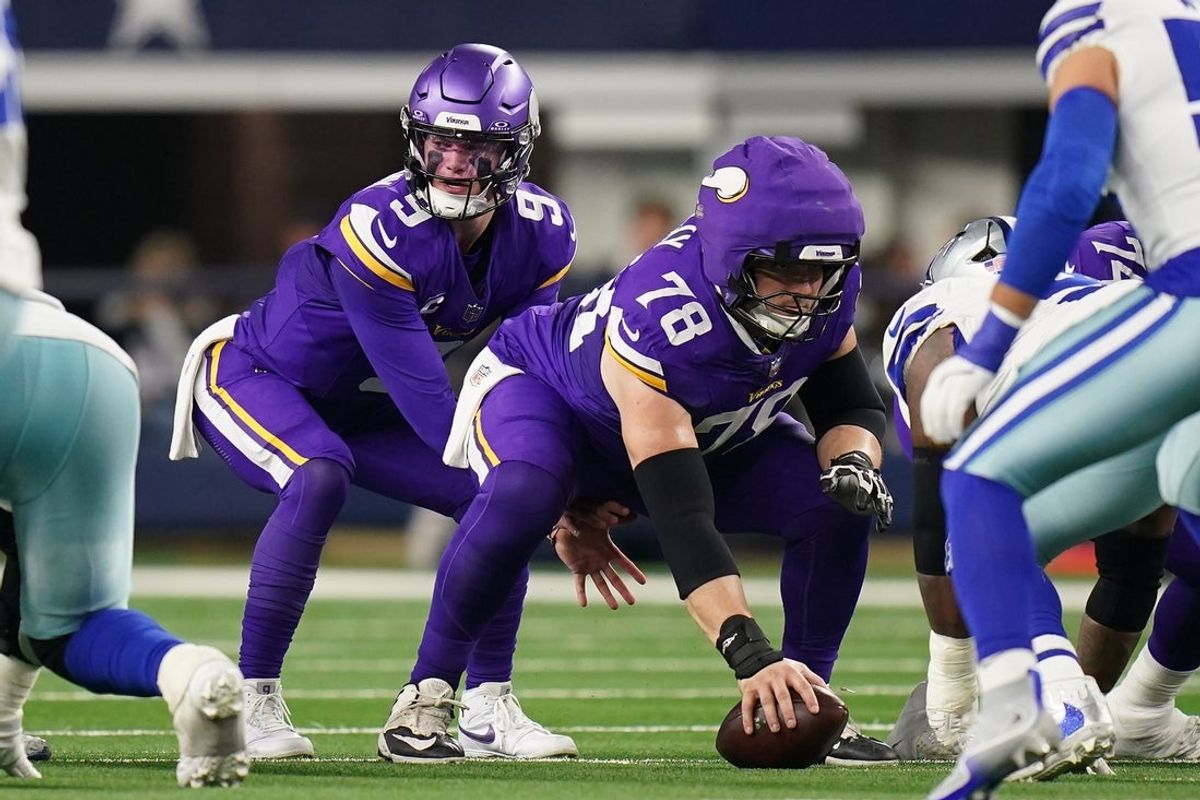 Dec 14, 2025; Arlington, Texas, USA;  Minnesota Vikings quarterback J.J. McCarthy (9) under center Ryan Kelly (78) during the first half against the Minnesota Vikings at AT&T Stadium. Mandatory Credit: Raymond Carlin III-Imagn Images
