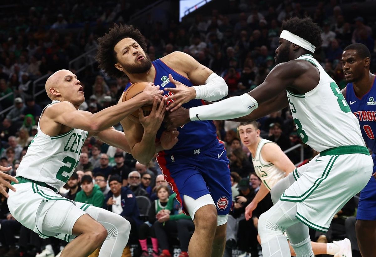 Dec 15, 2025; Boston, Massachusetts, USA; Boston Celtics guard Jordan Walsh (27) tries to rip the ball away from Detroit Pistons guard Cade Cunningham (2) during the first quarter at TD Garden. Mandatory Credit: Winslow Townson-Imagn Images