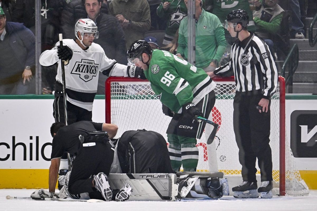 Dec 15, 2025; Dallas, Texas, USA; Dallas Stars right wing Mikko Rantanen (96) checks on Los Angeles Kings goaltender Darcy Kuemper (35) during the first period at the American Airlines Center. Mandatory Credit: Jerome Miron-Imagn Images