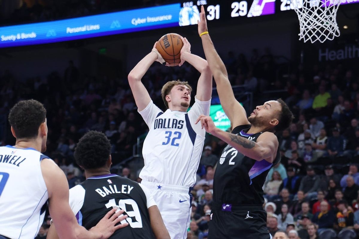 Dec 15, 2025; Salt Lake City, Utah, USA; Dallas Mavericks forward Cooper Flagg (32) goes to the basket as Utah Jazz forward Kyle Anderson (2) defends during the first quarter at Delta Center. Mandatory Credit: Rob Gray-Imagn Images